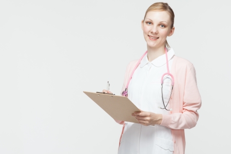 Beautiful caucasian nurse on white backgroundの写真素材