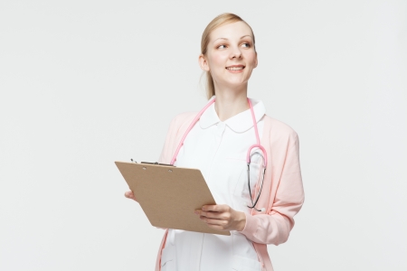 Beautiful caucasian nurse on white backgroundの写真素材