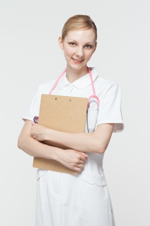 Beautiful caucasian nurse on white backgroundの写真素材