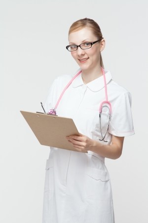Beautiful caucasian nurse on white backgroundの写真素材