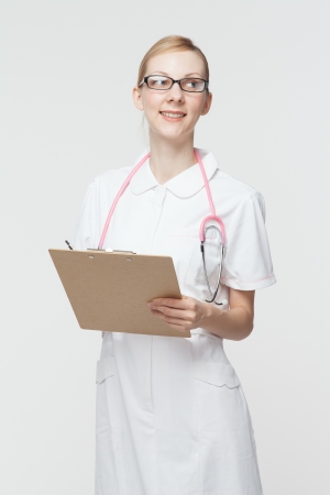 Beautiful caucasian nurse on white backgroundの写真素材