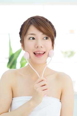 Beautiful asian woman relaxing in the roomの写真素材