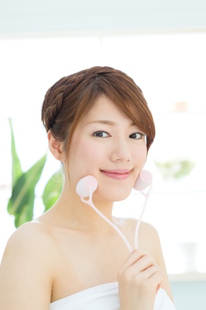 Beautiful asian woman relaxing in the roomの写真素材