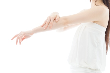 Beautiful young woman hands on white backgroundの写真素材