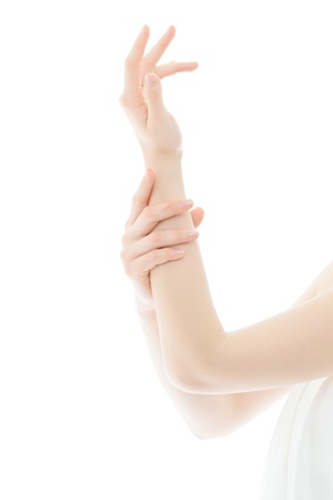 Beautiful young woman hands on white backgroundの写真素材