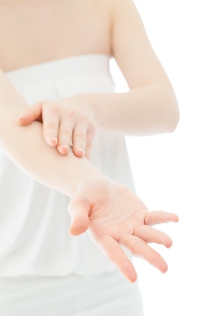 Beautiful young woman hands on white backgroundの写真素材