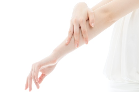 Beautiful young woman hands on white backgroundの写真素材