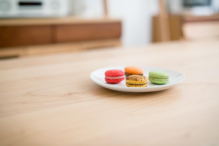 Delicious breakfast some macarons in a dishの写真素材