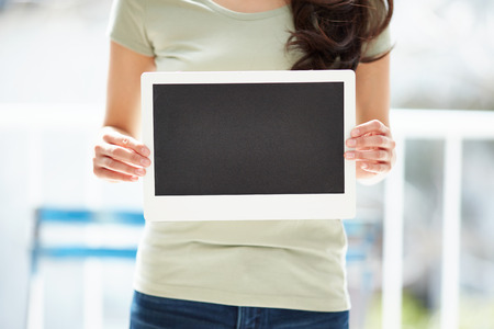 Young woman hand hold with the blackboard