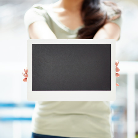 Young woman hand hold with the blackboardの写真素材