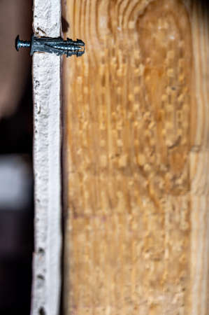 Side view of a drywall mount anchor and screw