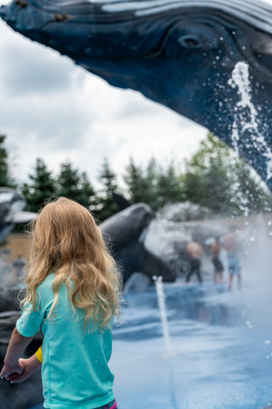 Omaha, Nebraska, USA: 6-2021: Scott Alaskan Adventure splash pad with children playing at the Henry Doorly Zoo and Aquariumのeditorial素材