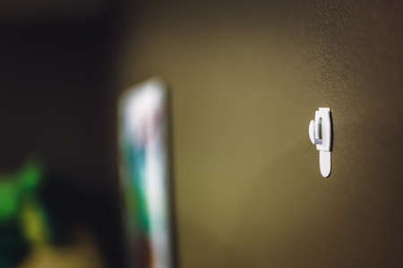 Selective focus on adhesive strip wall hanger that can be removed by pulling tapeの写真素材