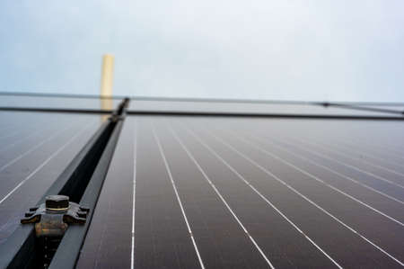 Side support bracked between solar panels on a new installation on a residential roof