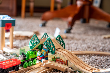 Tiffin, Iowa, USA - 3.2021: Small boy playing with a model Thomas the Train. Thomas is a popular railroad themed childrens toy.のeditorial素材