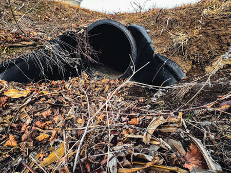 HDPE drainage culvert under a road entrance. Pipe is used to convey stormwater between ditches.の写真素材
