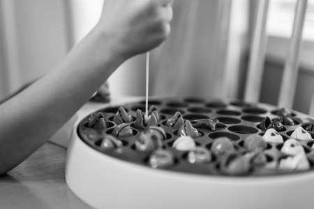 Childrens game of using a miniature pole and line lowered into open plastic fish to catch them as the pond spins.の写真素材