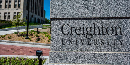 Omaha, Nebraska, US - 5.2022 - Entrance sign to Creighton University central campus.のeditorial素材