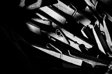 assorted pile of old cloths pins in a bag used for hanging wet laundryの写真素材