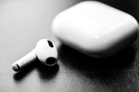 Tiffin, Iowa - 6.2022 - Missing Apple AirPod with a charging case next to it.のeditorial素材