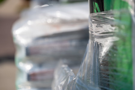 Selective focus on cellophane shrink wrap on pallets of goods for transport.の写真素材