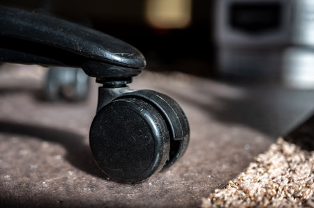 Transition between carpet and hard protective mat for a home office rolling desk chairの写真素材