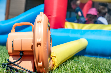 Subject focus on bouncy house blower fanの写真素材