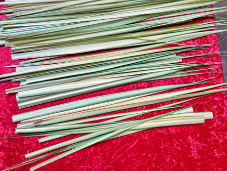Palm frond leaves laid out on a table during Christian Sunday service.