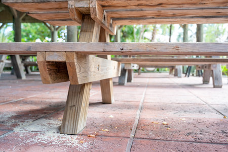 Spilled drink on a wooden picnic bench.の写真素材