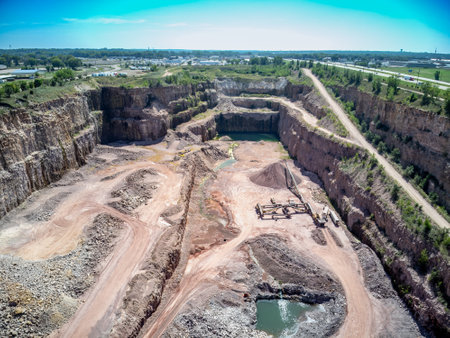 Open pit view of a quartzite rock quarry in Sioux Falls, South Dakota