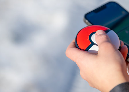 Sioux Falls, South Dakota, USA - 12.9.2023: Selective focus on a Pokemon Go Plus game deviceのeditorial素材
