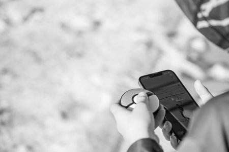 Sioux Falls, South Dakota, USA - 12.9.2023: Selective focus on a Pokemon Go Plus game device