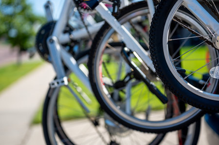 vertical mounted bikes on a vehicle carrier attached to a trailer hitch.
