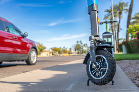 Selective focus on front wheel of a rental electric scooter in Phoenix, Arizona