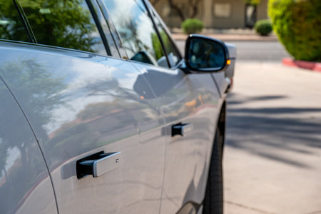 Phoenix, Arizona, USA - 3.23.2024: automatic recessed door handles a Waymo self-driving car while...