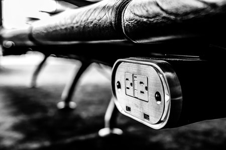 Selective focus on airport terminal phone charging outlet station
