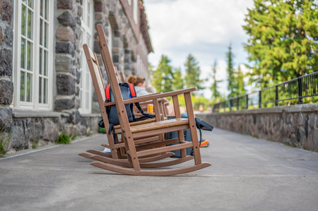 rocking chairs on the outdoor walkway of the lodge overlooking Crater Lake National Parkの写真素材