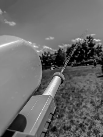 First person point of view spraying a pressurized toy water gunの写真素材