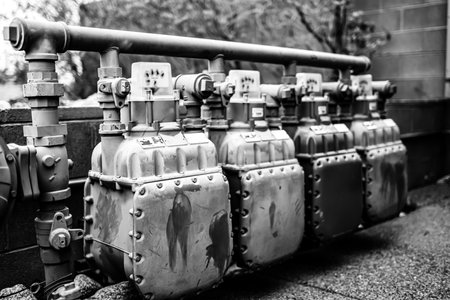 Row of gas meters feeding businesses outside.の写真素材