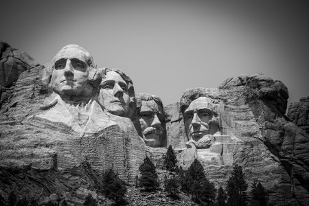 Mount Rushmore in the Black Hills of South Dakota against a clear sky.の写真素材