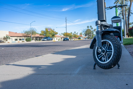 Selective focus on front wheel of a rental electric scooter in Phoenix, Arizonaの写真素材