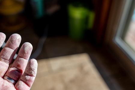 cracked dried clay on an open handの写真素材