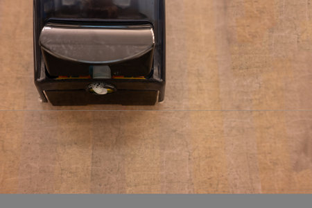 Selective focus on the underside of a bathroom soap dispenserの写真素材