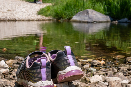 Selective focus a pair of shoes left on the bank of Spring Creek on the Sheridan Lake trail in the Black Hills of South Dakota.の写真素材