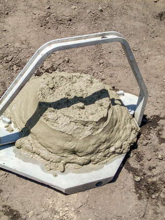 Concrete slump test from cone to determine workabilityの写真素材