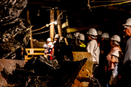 Selective focus on anthracite coal on a conveyer belt with defocused group in the Lackawanna Coal Mine Tour at McDade Park.の写真素材