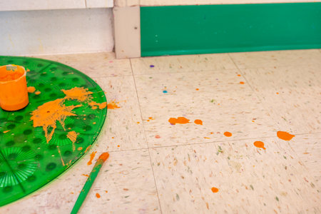paint splattered on the floor in an arts and craft room at a schoolの写真素材