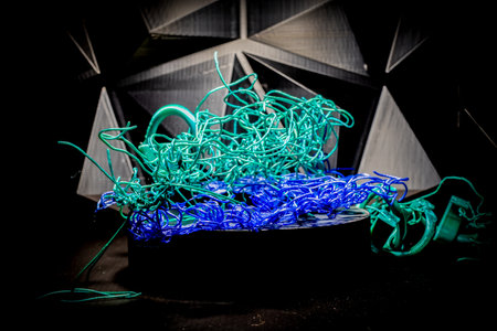 Massive spaghetti failure on a 3D printer caused by high temperatures turning filament into a fluid state.の写真素材