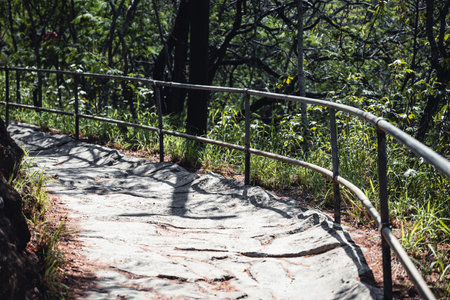 Selective focus on an uneven surface of the hiking trail to the summit of Diamond Head State Monument in Oahu, Hawaiiの写真素材