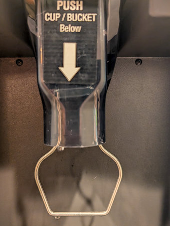 Selective focus on a hotel ice machine discharge shoot.の写真素材